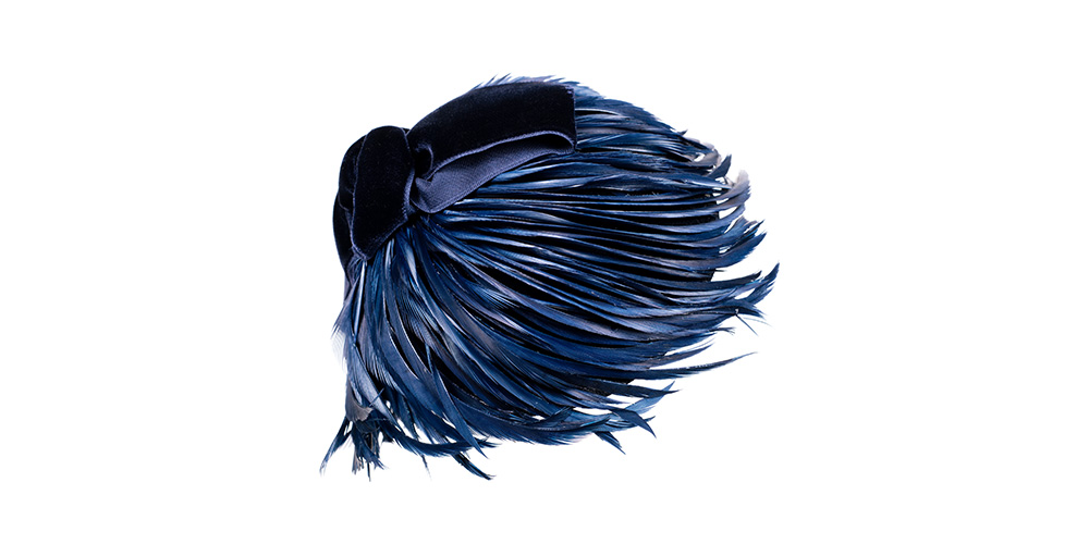 Coated cap with goose feathers