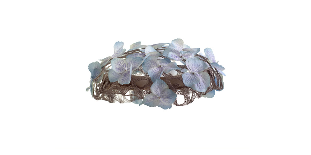 Cap with flowers on a course veil