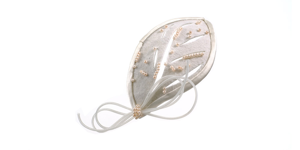 Bridal hair clip with satin leaves and veil